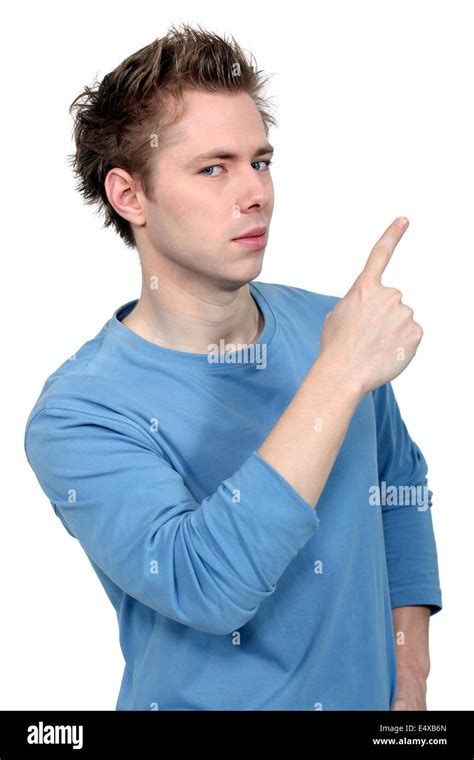 Young Man Pointing Up At Copy Space Stock Photo Alamy