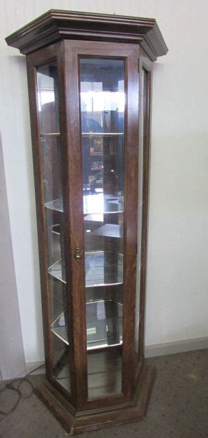 It consists of 3 shelves arranged vertically. Lot Detail - TALL GLASS CURIO DISPLAY CABINET
