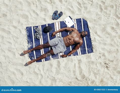 Young Guy Lying Shirtless On A Mat Sunbathing Stock Photo Image Of