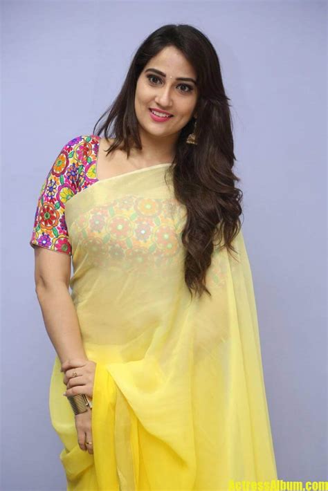 tv anchor manjusha hot stills in yellow saree actress album