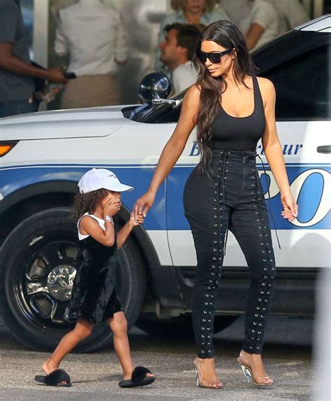 north west hits paparazzi with her signature side eye while out with kim kardashian kim