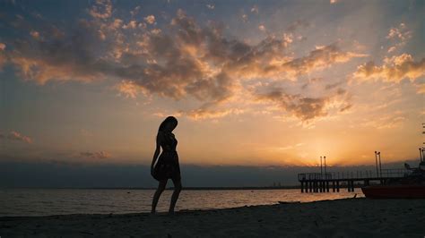 Silhouette Of Person In Light Dress On Beach Stock Footage Sbv