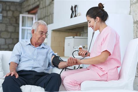 Nurse Taking Old Mans Blood Pressure Stock Photo Download Image Now