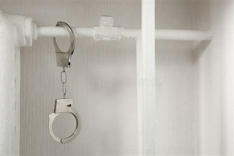 Handcuffs On The Radiator Police Handcuffs And Collar Stock Image