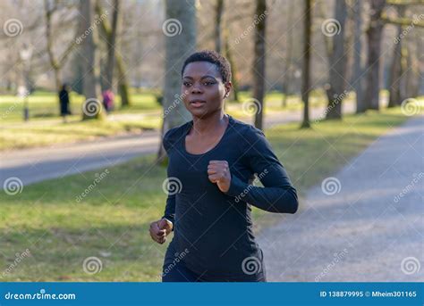 Determined Young African Woman Training In A Park Stock Image Image