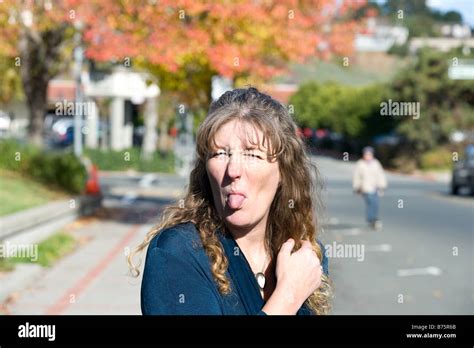 Woman Sticking Out Her Tongue Stock Photo Alamy