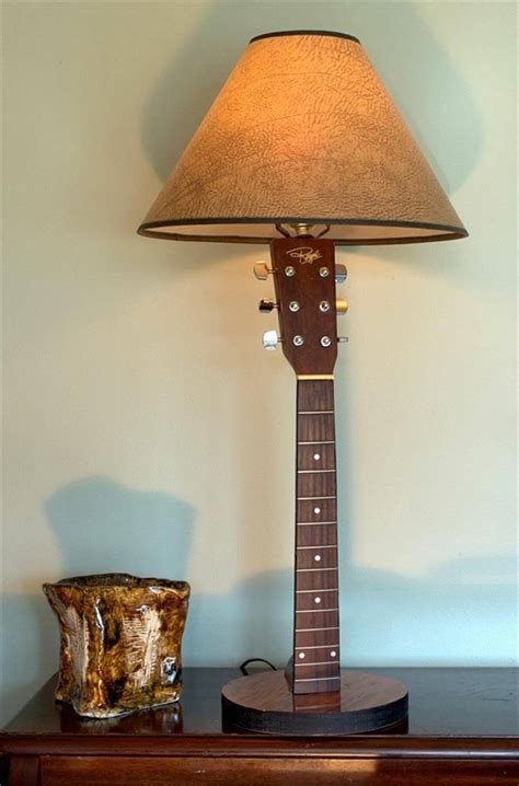 Repurpose an old yard sale lamp into a garden masterpiece with this simple diy. 15 DIY Old Guitar Ideas