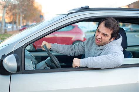 Closeup Portrait Of Aggressive Male Driver Honking In Traffic Jam Stock