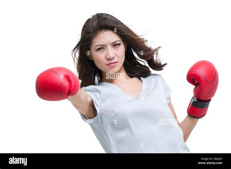 Young Woman Wearing Boxing Gloves And Punching Stock Photo Alamy