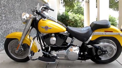The fat boy® is an icon, riding on a 240mm rear tire, 160mm front tire and solid disc wheels. 2006 Harley-Davidson Fat Boy, Pearl yellow, Samson Street ...
