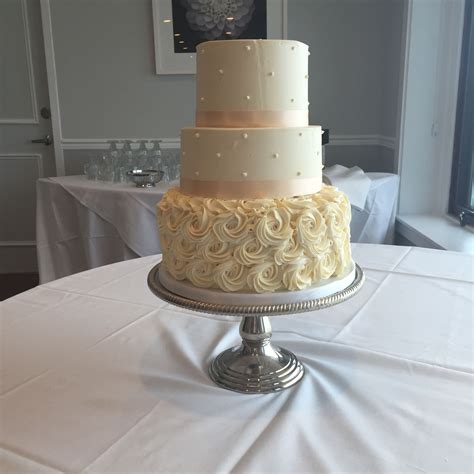 Peach And White Wedding Cake With Buttercream Rosettes And Swiss Dots