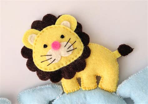 To make the creases, fold a loop in the bigger circle of felt. Lion Felt Baby Name Banner | AllFreeSewing.com