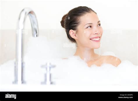 Happy Beautiful Young Mixed Race Asian Caucasian Woman In Bathroom Enjoying In Bathtub With