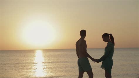 couple silhouette at the beach sunset light stock footage video 3600434 shutterstock