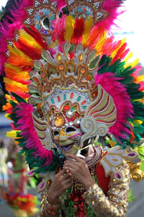 A Colorful Headdress And Mask Worn By A Dancer Of The Masskara Festival