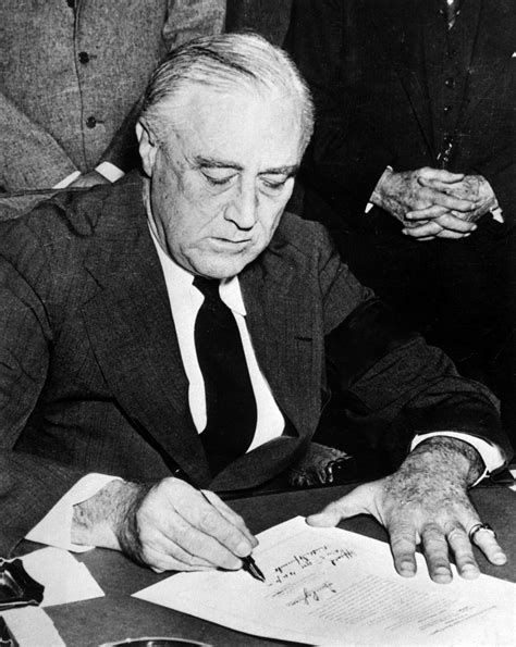World War Ii Pictures In Details President Franklin D Roosevelt Signs The Declaration Of War