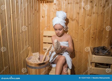 Girl Enjoying A Relaxing Stay In The Saunayoung Girl Relaxing In Sauna