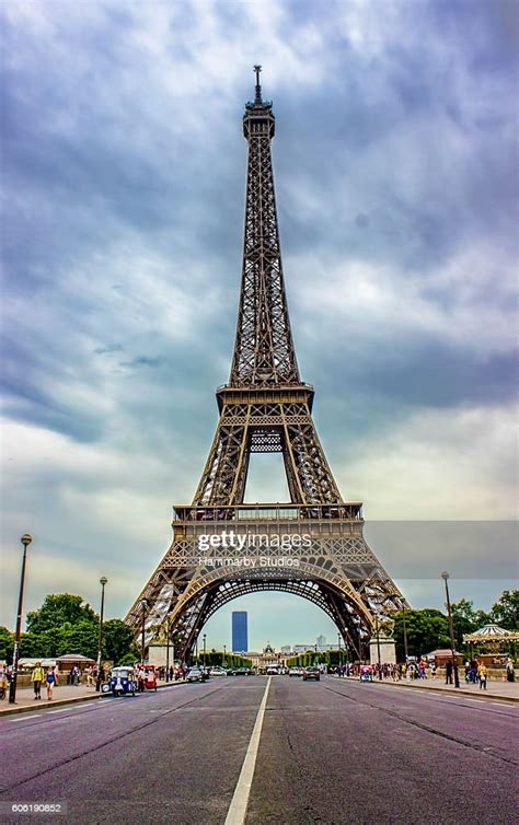 Eiffel Tower Under Cloudy Sky In Paris France High Res Stock Photo