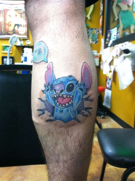 A Man With A Tattoo On His Leg That Has A Stitching Stitch In It