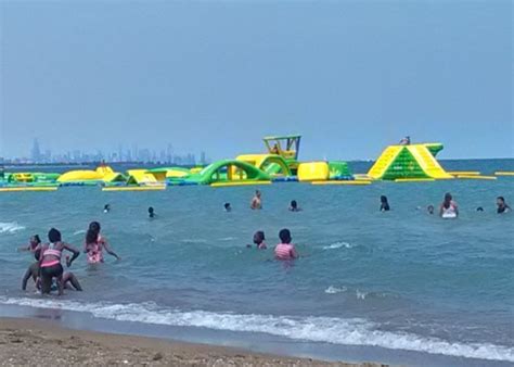 Floating On The Waters Of Lake Michigan This Incredible Inflatable Playground Offers Fun For