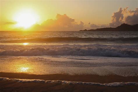 Flare Ocean Waves Crashing On Shore During Sunset Sunlight Image Free Photo