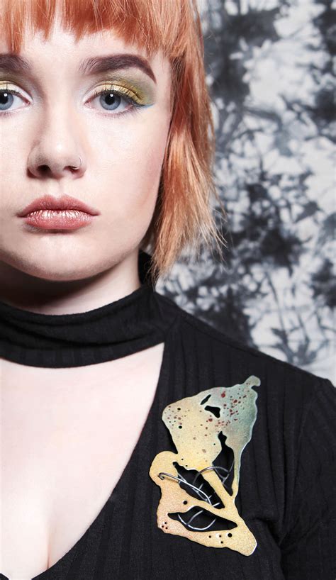 Graduation details for class of 2021 families. Brooch by Leah Wadey, 2016 graduate from UCA Rochester ...