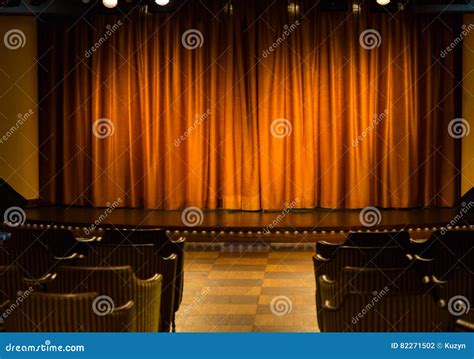 Small Stage With Orange Curtains In Cameral Private Cinema Stock Photo