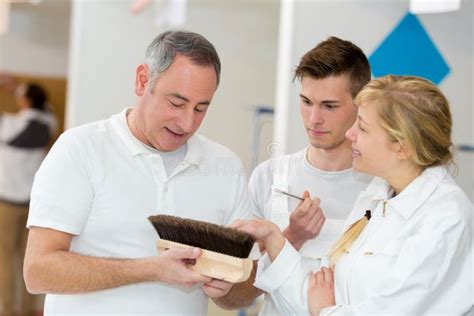 Apprentices Learning How To Paint With Thick Brush Stock Image Image