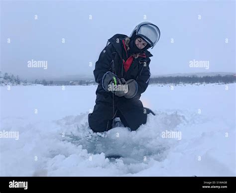 Frozen Lake Fishing Stock Photo Alamy