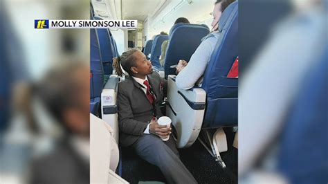 delta airlines flight attendant caught on video consoling passenger during turbulence abc7 los