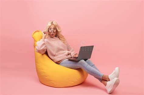 Deadline Concept Emotional Freelancer Woman Sitting In Bean Bag Chair