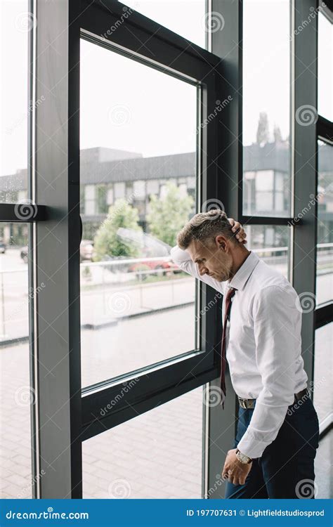 Businessman In Suit Standing Near Windows In Office Stock Image Image
