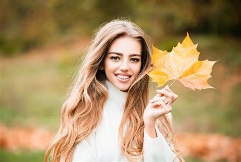 Happy Autumn Young Blonde Woman Portrait In Autumnal Color Stock