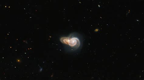Hubble Captures 2 Galaxies Overlapping To Form A Stunning Interstellar