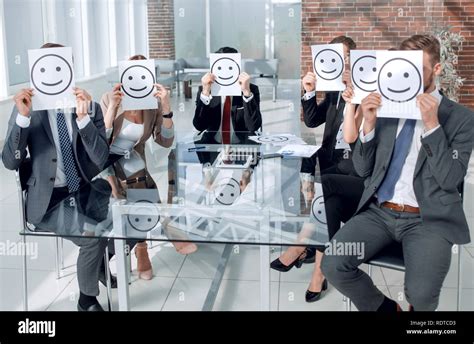 Positive Smiley Hiding Faces Of Businessmen Stock Photo Alamy