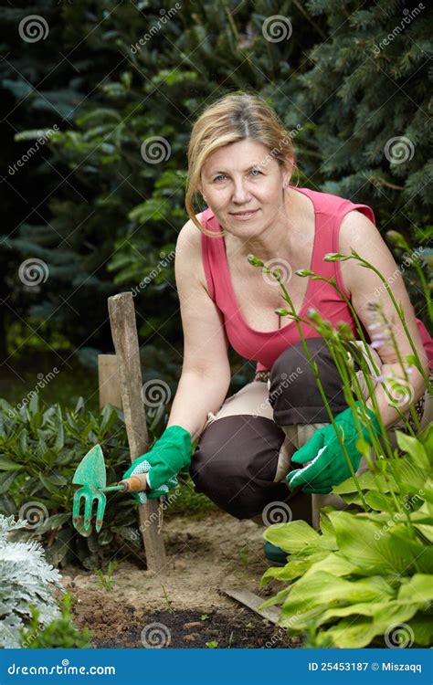 Mature Woman Works In Her Garden Stock Image Image Of Lady Life