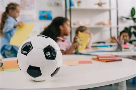 Selective Focus Of Soccer Ball On Table And Multiracial Preschoolers