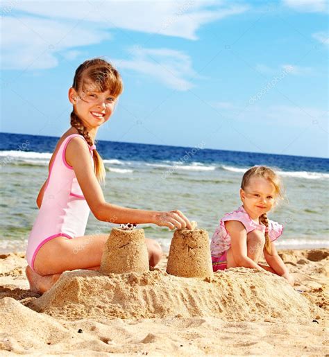 Children Playing On Beach Stock Photo By ©poznyakov 6335593