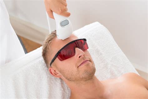 Beautician Giving Laser Epilation Treatment Stock Image Image Of