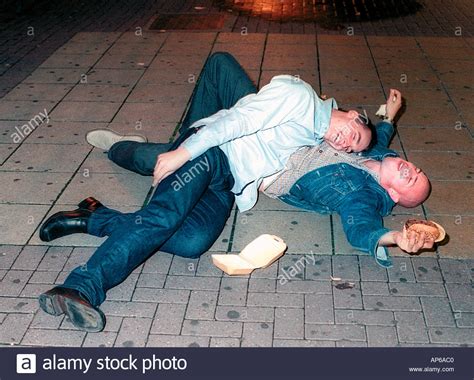 Two Drunk Young Men Almost Passed Out On Pavement After Heavy Friday