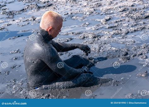 A Man Applies Healing Mud To His Body Beneficial Effect On The Body