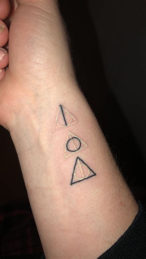Harry Potter Deathly Hallows Tattoo With White And Black Ink Showing