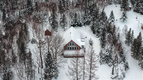 Download Wallpaper 2560x1440 Mountain House Aerial View Trees Snow