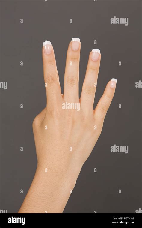 Caucasian Female Using Hand Gestures By Signing Holding Up Four Fingers