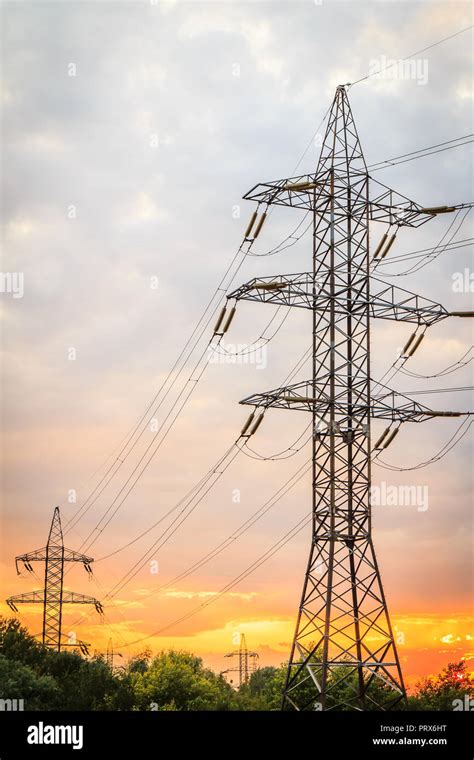 High Voltage Power Transmission Towers With Electrical Energy Wires At