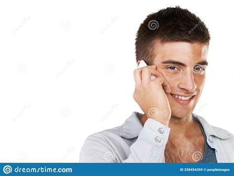 your voice makes me smile a smiling male talking on his cellphone with copy space stock image