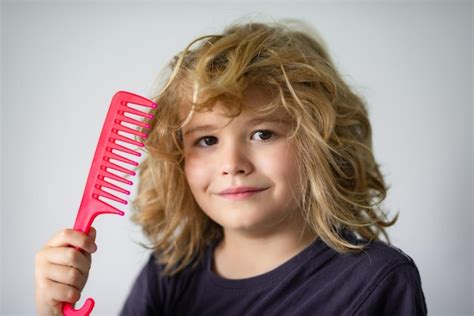 Premium Photo Boy Brushes His Hair Child With A Comb And Problem Hair