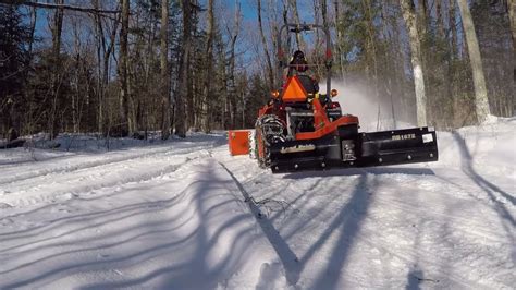Kubota B2601 Compact Tractor Adjusting Tire Chainsplowing Snow On A