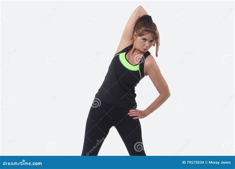 Attractive Middle Aged Woman In Sports Gear Stretching Her Arm Stock