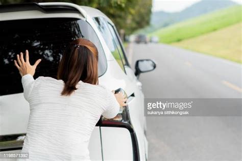 Pushing Broken Car Photos And Premium High Res Pictures Getty Images
